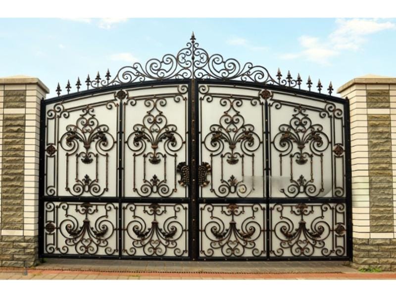 Ornate iron gate detail—alignment and hardware repair in Alvin, TX.