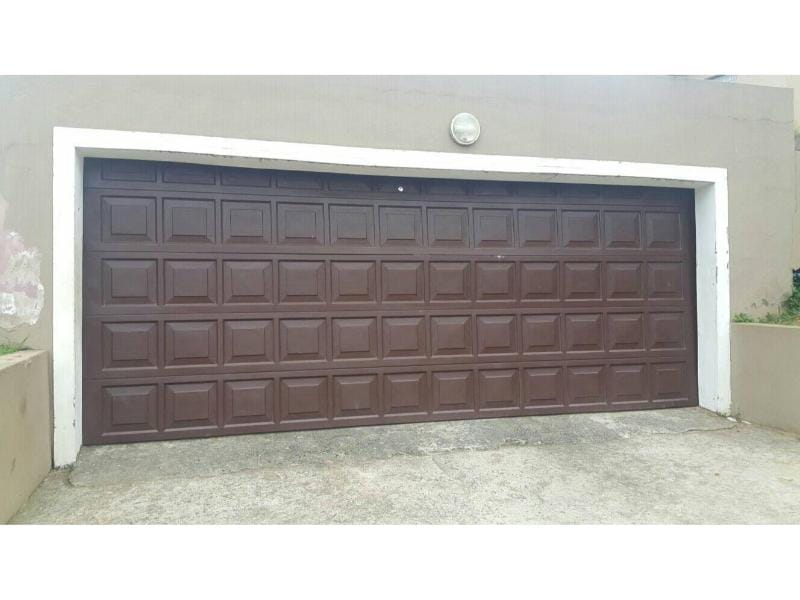 Residential door panel shown for automatic & manual gate repair in Alvin, TX.