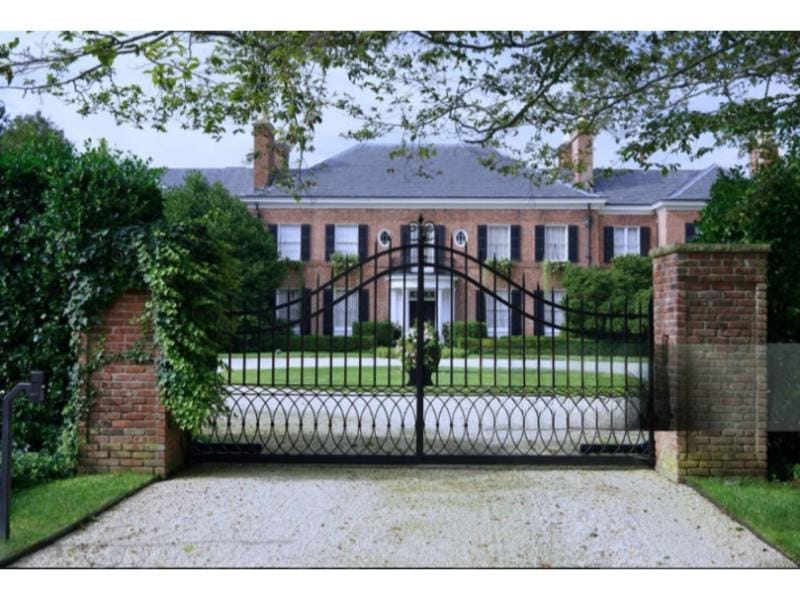 Wrought iron swing driveway gate—automatic & manual gate repair in Alvin, TX.