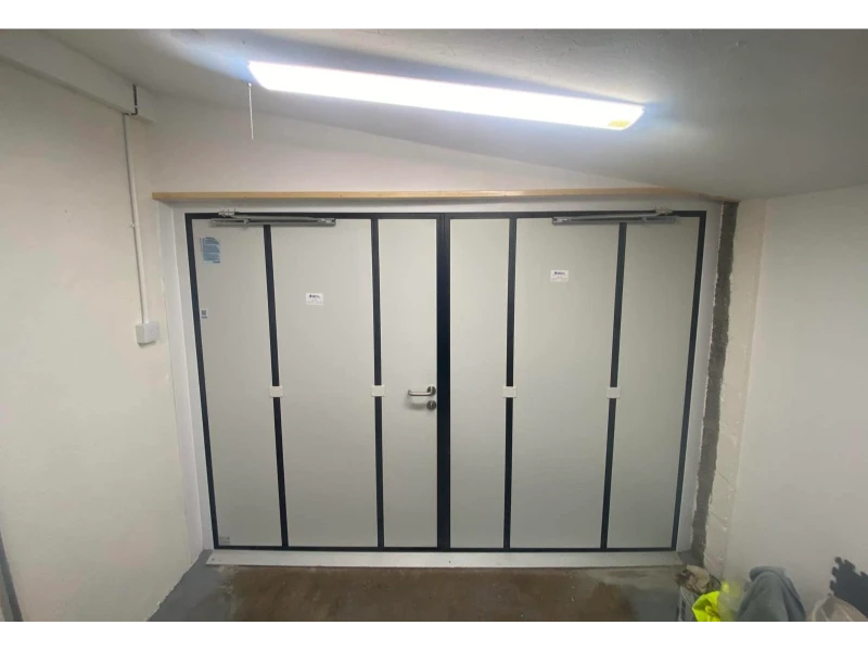 Commercial double swing doors with closers after installation service — commercial door & dock services in Alvin, TX.