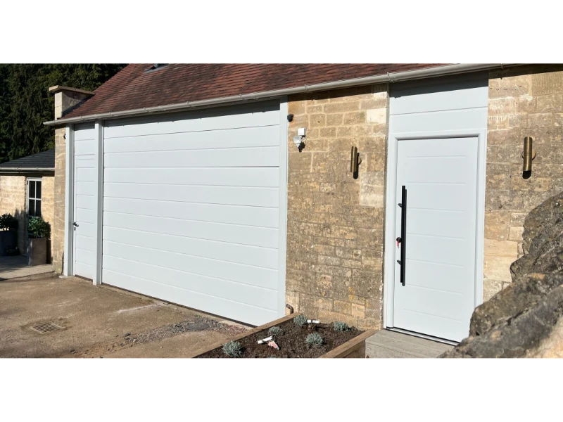 Exterior commercial garage door and entry door installation — commercial door & dock services in Alvin, TX.