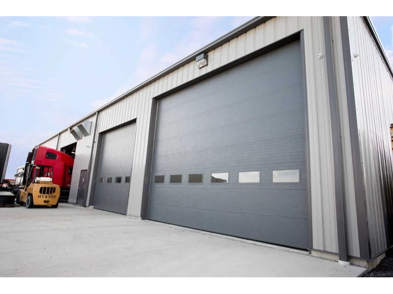 Industrial facility with a row of large commercial overhead doors for loading areas.