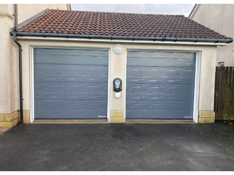 Exterior garage with two gray sectional overhead doors – Dock Leveler & Dock Equipment Repair Alvin, TX
