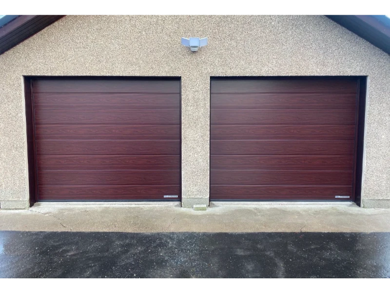 Exterior building with two brown woodgrain sectional overhead doors – Dock Leveler & Dock Equipment Repair Alvin, TX