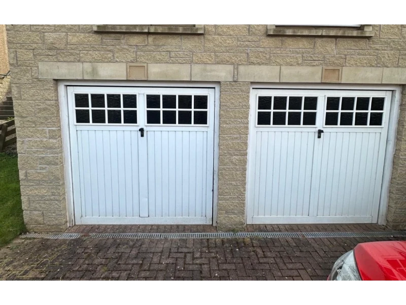 Emergency Garage Door Repair in Alvin, TX – white carriage-style double garage doors with windows