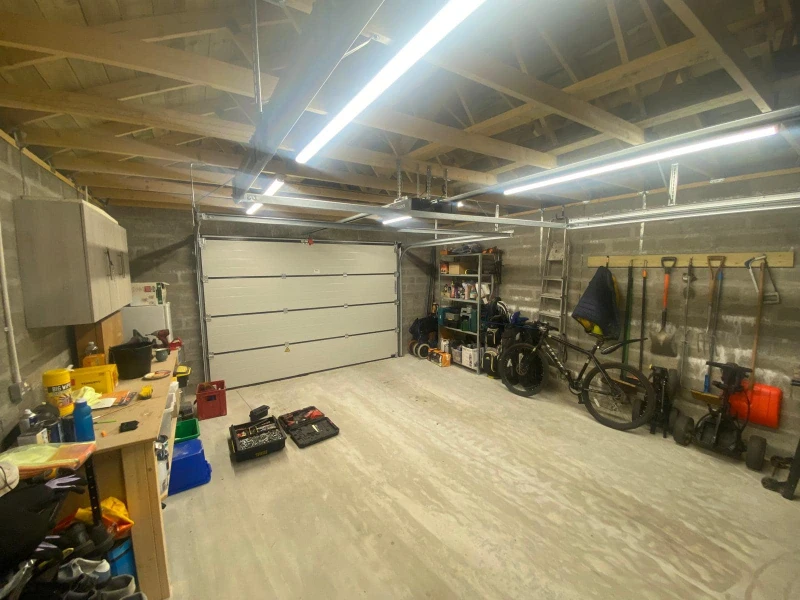 Garage Door Hardware Repair & Tune-up Services in Alvin, TX – closed garage door with track hardware inspected and adjusted.