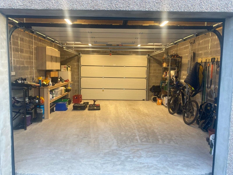 Garage Door Hardware Repair & Tune-up Services in Alvin, TX – garage door hardware check from the exterior after service.