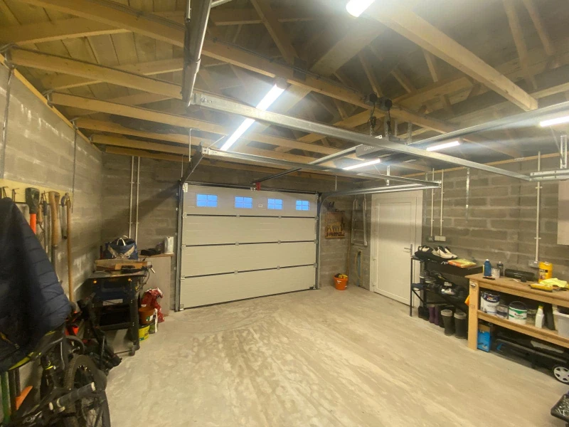 Garage Door Hardware Repair & Tune-up Services in Alvin, TX – newer sectional door with hardware and opener system tuned up.
