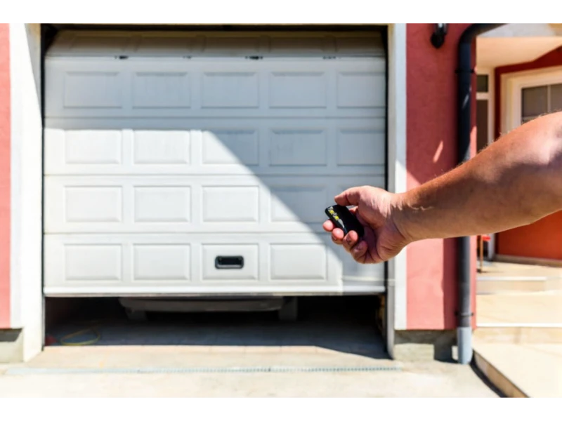 Garage Door Keypad & Remote Programming Alvin, TX – remote opening the garage door from outside the home.