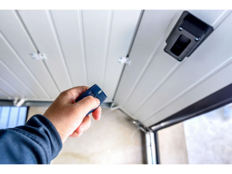 Garage Door Keypad & Remote Programming in Alvin, TX – pairing a handheld remote with the garage door opener receiver.
