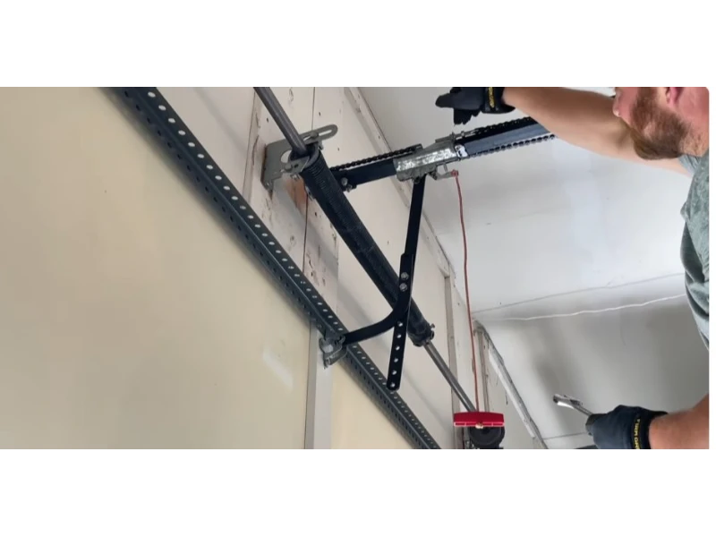 Garage Door Opener Installation in Alvin, TX - adjusting chain tension on the opener rail
