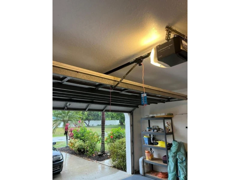 Garage Door Opener Installation in Alvin, TX - opener rail and motor setup in progress