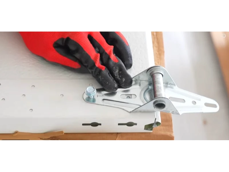 Garage door roller and hinge bracket replacement to restore smooth door travel in Alvin, TX.