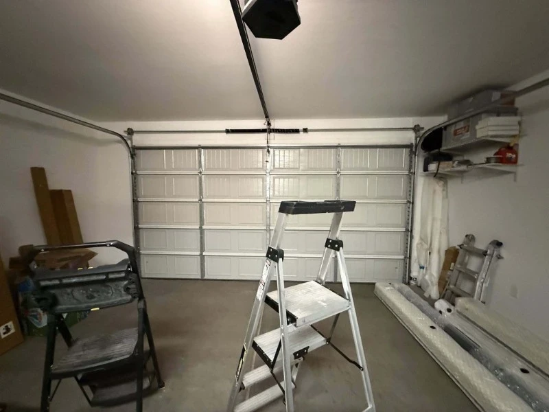 Annual garage door tune-up inspection setup in Alvin, TX, including safety checks and hardware review.