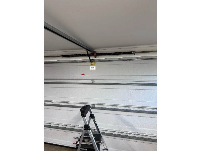 Best & Reliable Garage Door repair services in Alvin, TX – torsion spring system replacement setup for a residential garage door in Alvin, TX
