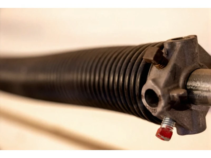 Close-up of torsion spring and winding cone used in broken spring replacement for Alvin garage doors.