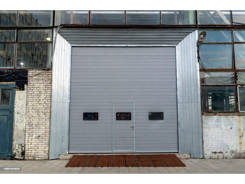 Heavy-duty rolling steel door repair Alvin, TX – large gray roll-up door