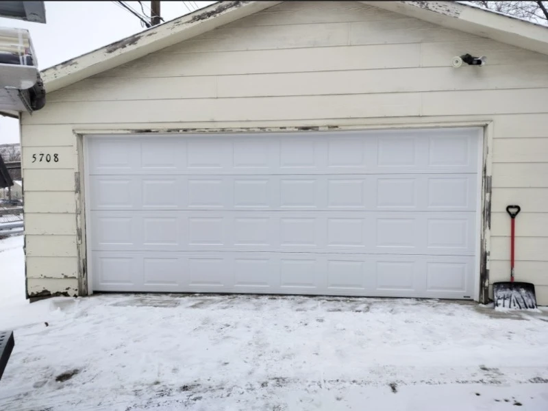 Residential garage door protected against cold drafts with new seals in Alvin, TX